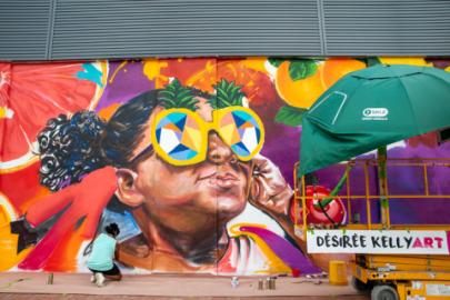 man,colorful,orange,truck,front,painted,food,large,street,standing,holding,woman,young,riding,bus,playing