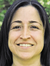 a woman smiling for the camera