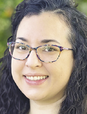 a close up of a woman wearing glasses