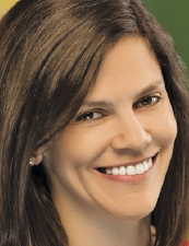 a close up of a woman who is smiling and looking at the camera