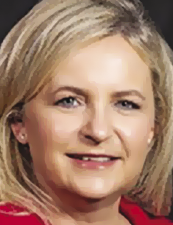 a close up of Bridget Lancaster who is smiling and looking at the camera