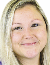 a close up of a woman who is smiling at the camera