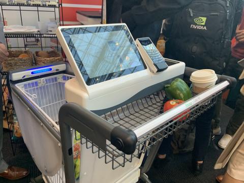 A Caper smart shopping cart on display at the NRF Show