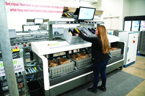 Pickers complete up to four orders at a time at the Safeway MFC for pickup or delivery.