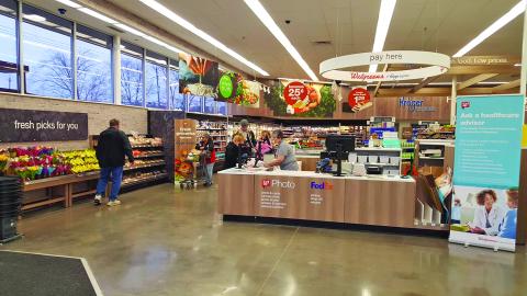 A front end at a Walgreens store in Fountain City, Tennessee, features a reconfigured central checkout area.