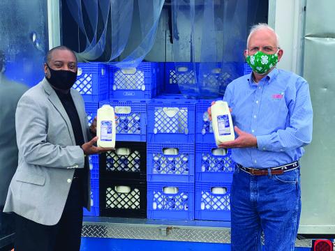 In April, Kroger kicked off its Great Georgia Give milk donation campaign with Georgia Commissioner of Agriculture Gary W. Black (right). The retailer's Dairy Rescue Program to support children and families during the pandemic will now run through the summer.