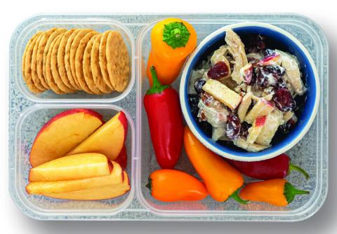 A display of several bento boxes in the produce department
