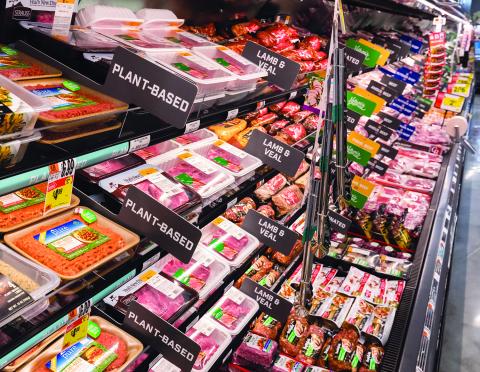 More grocers are merchandising plant-based meat products alongside their animal protein counterparts, as at this recently opened Giant store in Fairfax, Virginia.