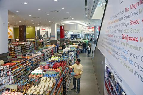 a group of people standing in front of a store