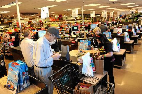 a group of people standing in front of a store