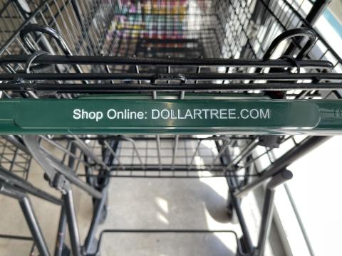 a sign on a metal bench