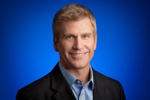 Kirk Perry wearing a suit and tie