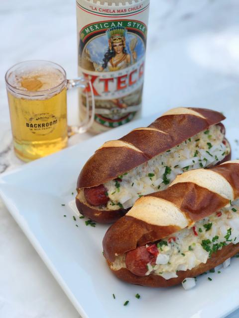 Barons Market Backyard Beer Pairing Looks Forward to Summer Cerveza Xteca Pimento Cheese Pretzel Dogs