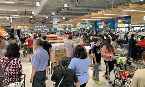a group of people standing in front of a store