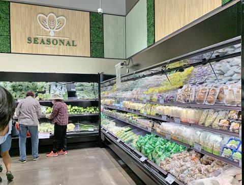 a group of people standing in front of a store