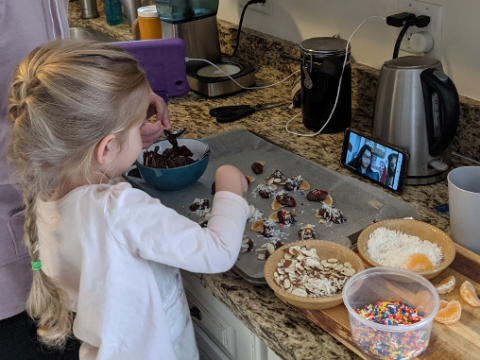 a little girl that is eating some food
