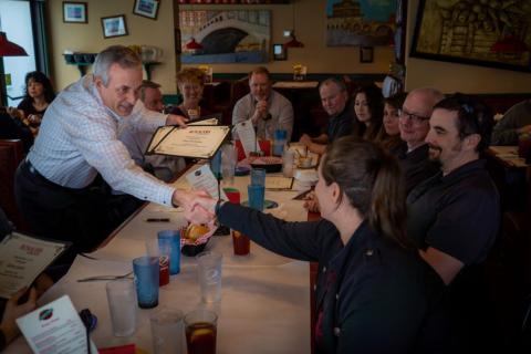 a group of people sitting at a table