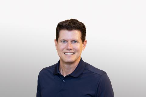 Jason J. Buechel smiling for the camera