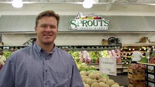 a man standing in front of a store