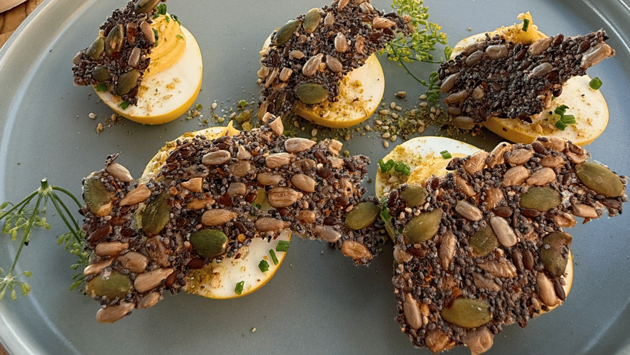 Whole Foods Market culinarians created a recipe to illustrate the "protein power up" trend: turmeric deviled eggs with dukkah, seedy cracker and fresh herbs.