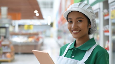 grocery employee with phone