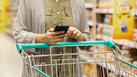 Shopper Using App in Grocery Store Teaser