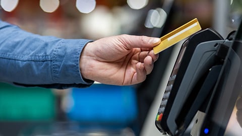 Man Paying With Credit Card in Supermarket Teaser