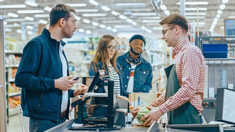 Grocery shoppers at register