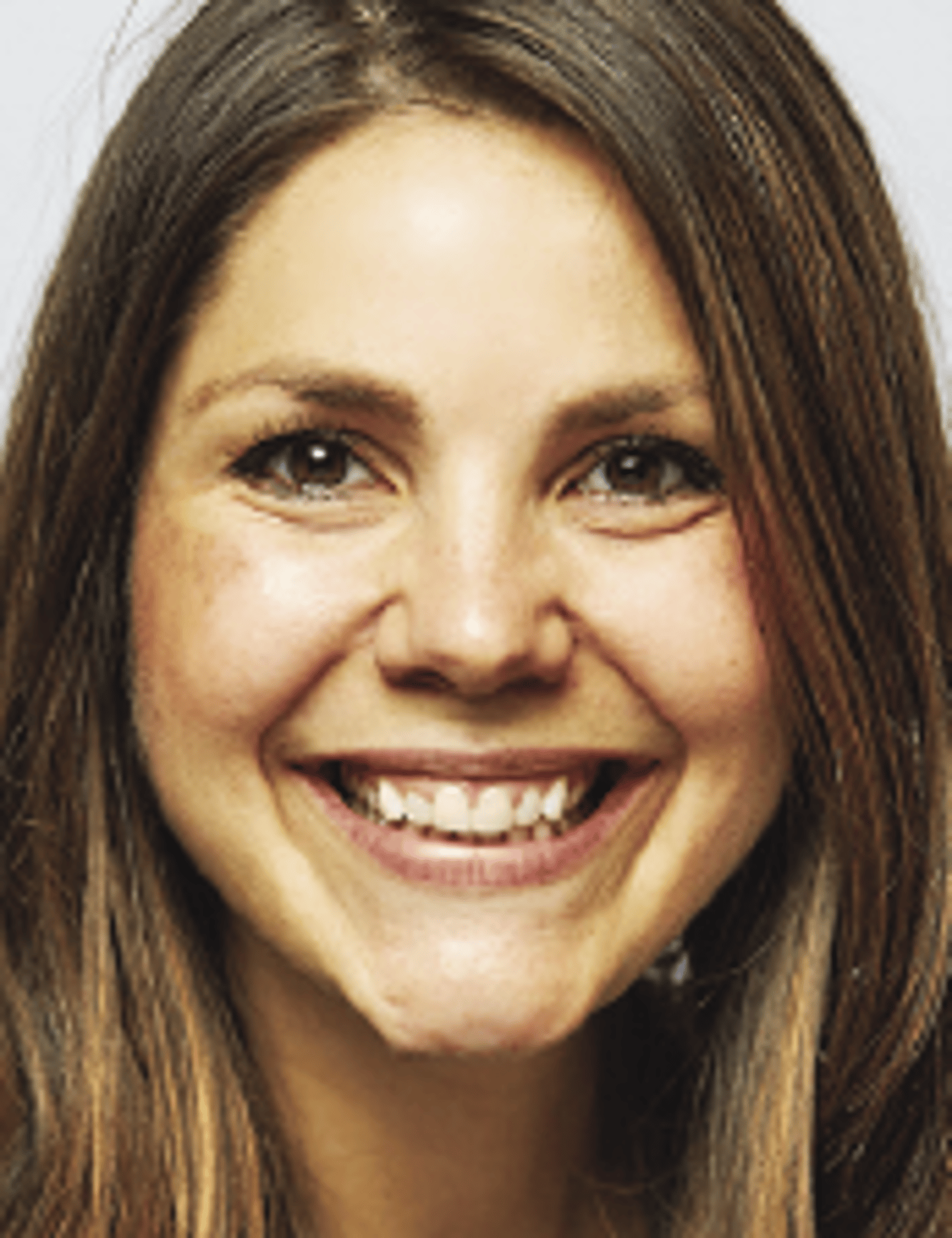 a close up of a woman who is smiling at the camera