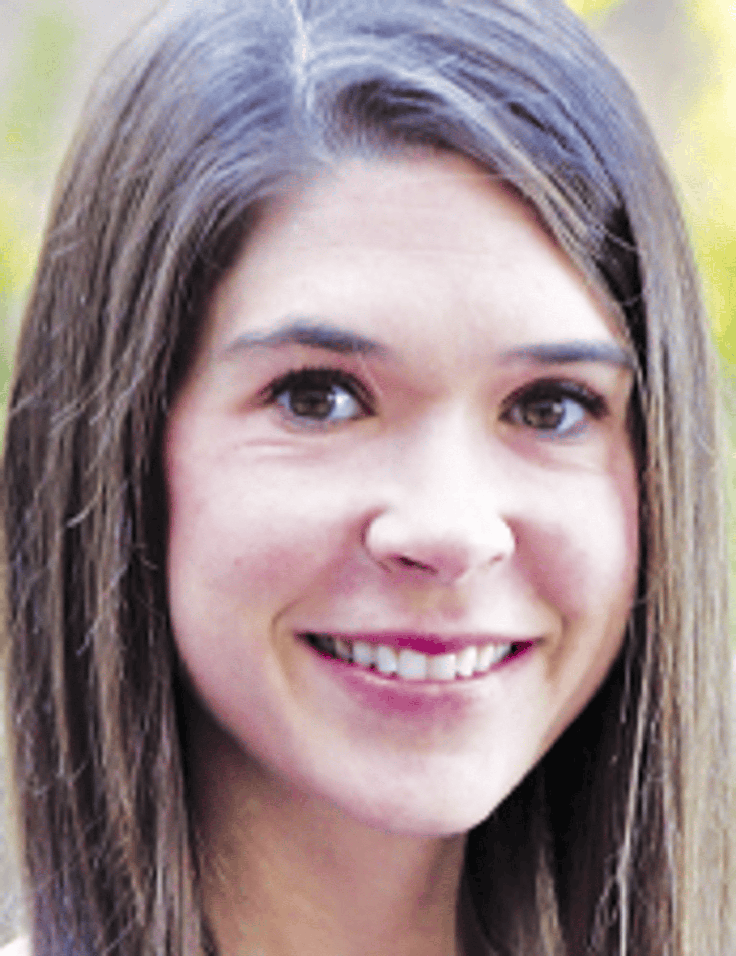 a close up of a woman who is smiling at the camera