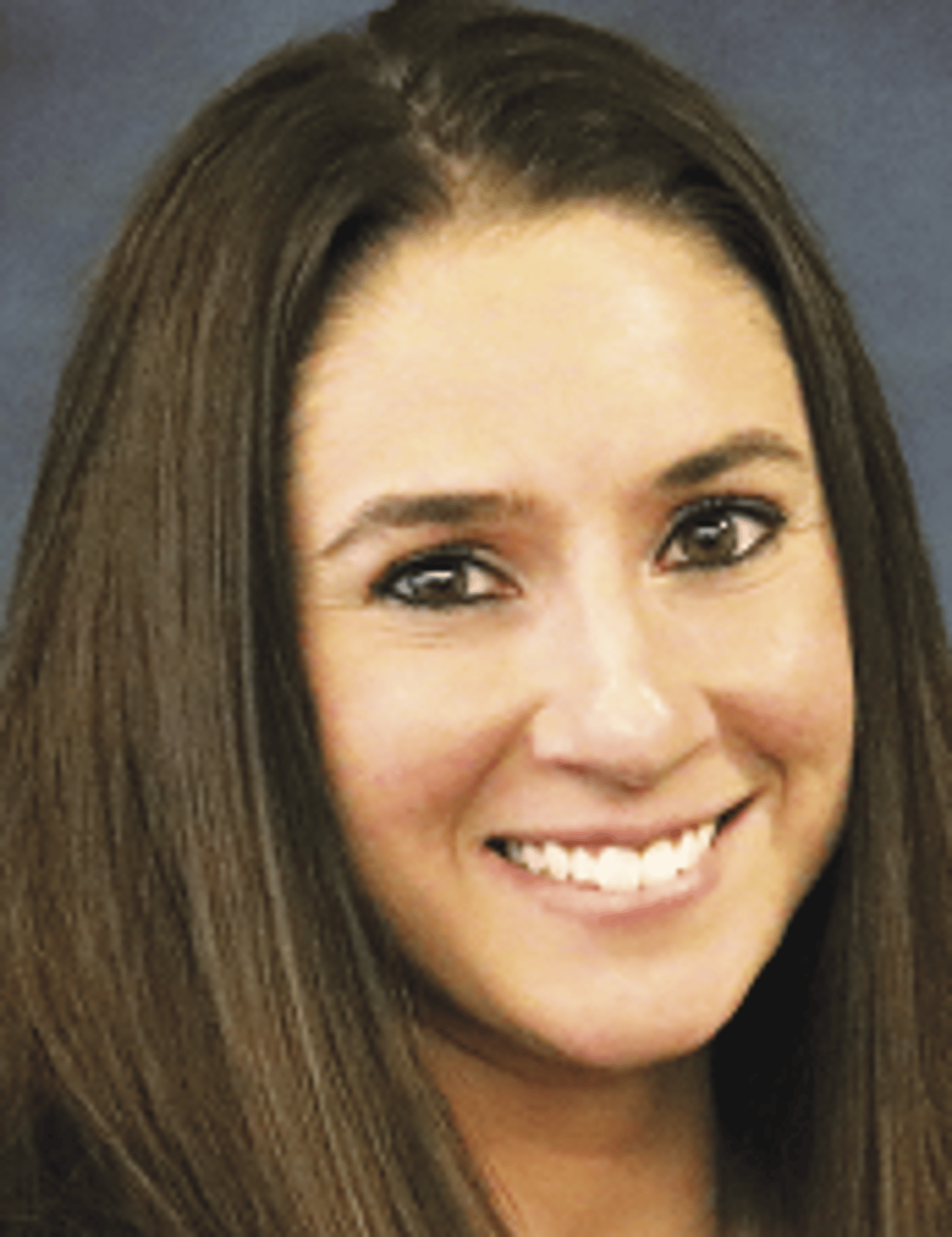 a close up of a woman who is smiling at the camera