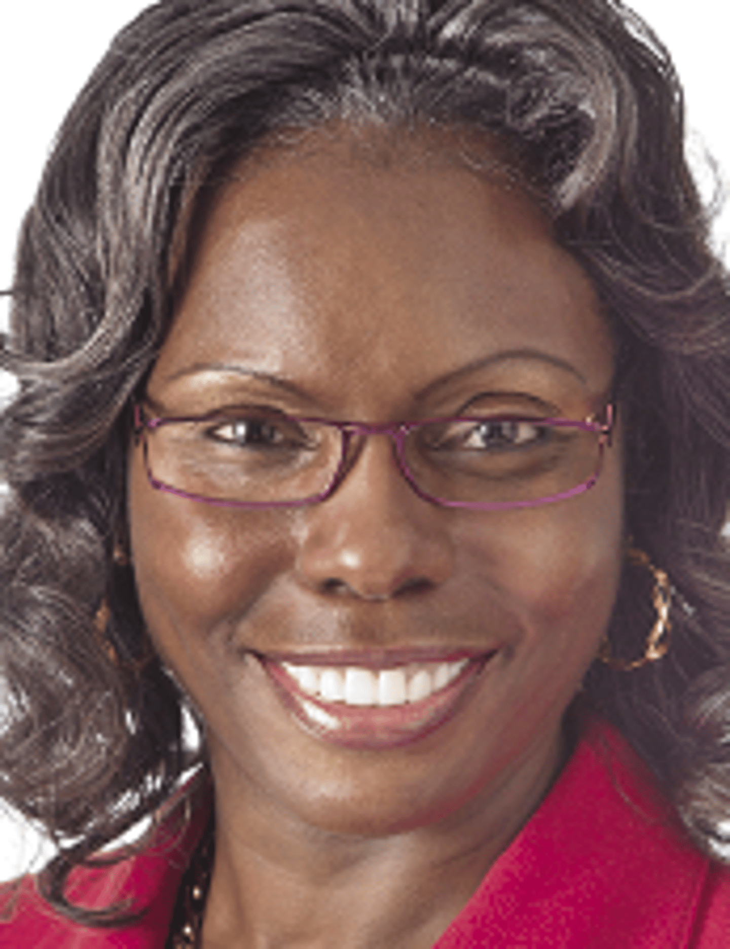 a woman wearing glasses and smiling at the camera