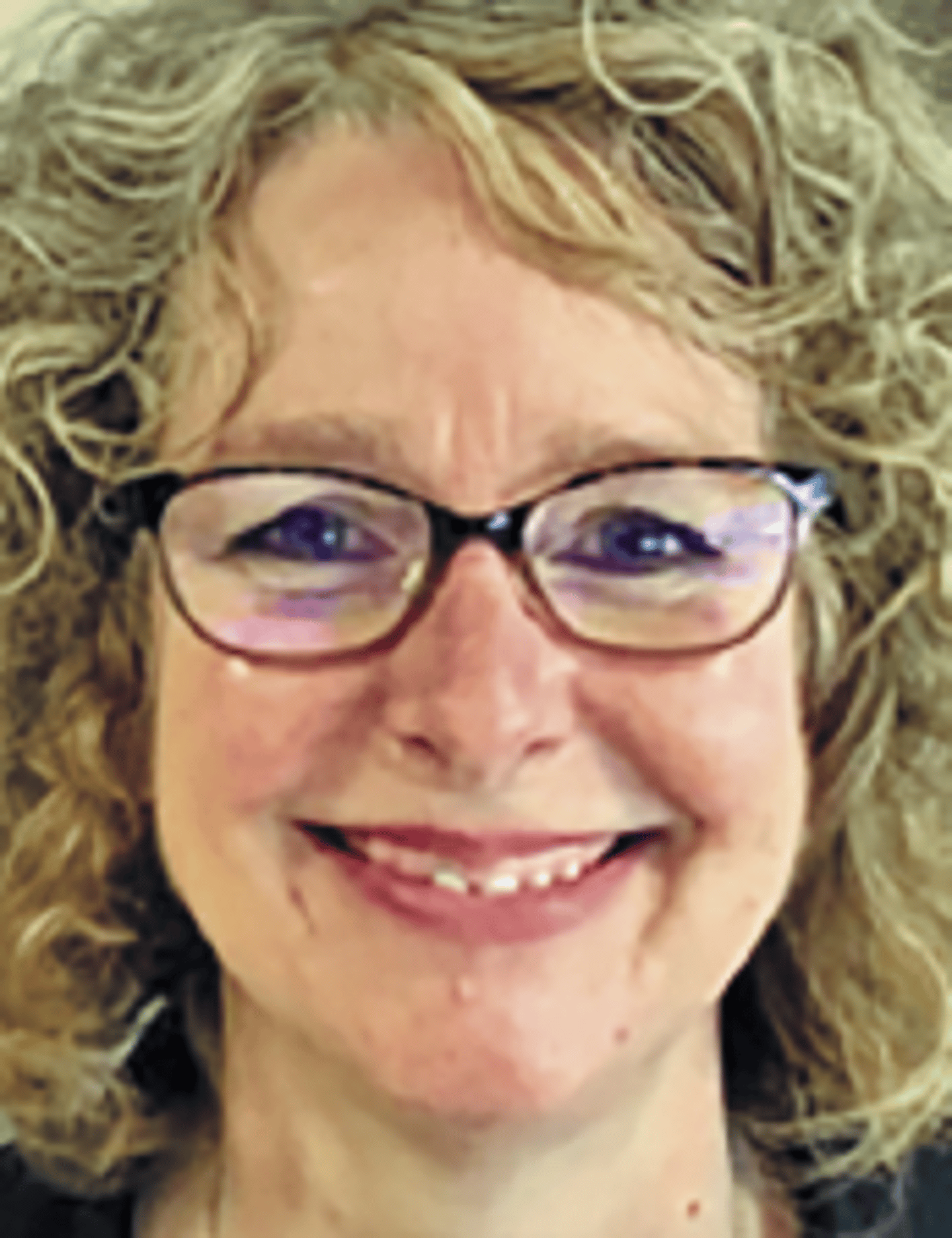 a close up of a woman wearing glasses