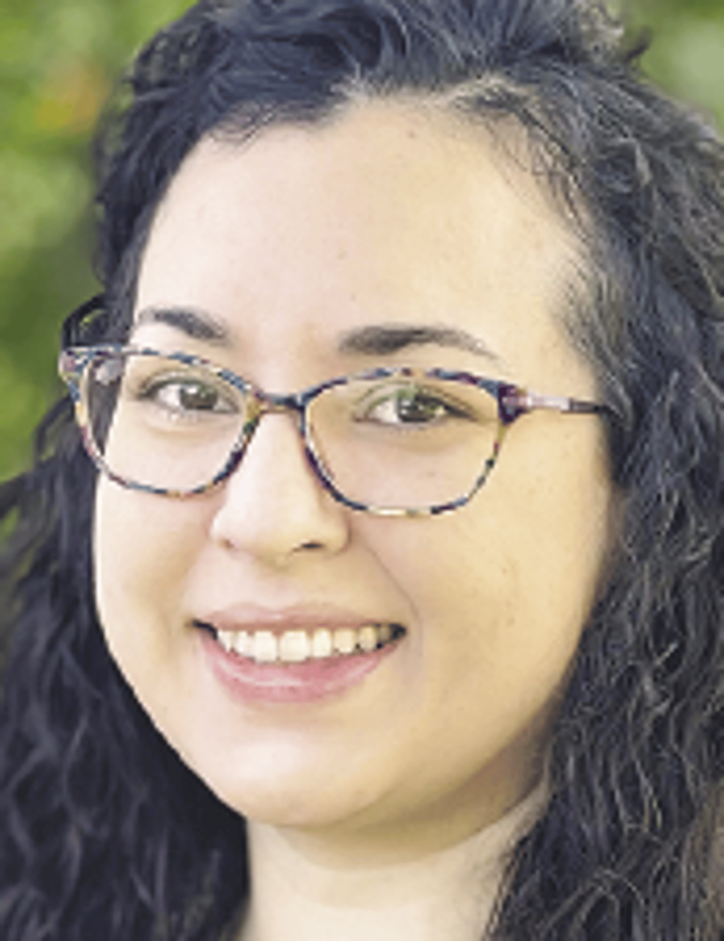 a close up of a woman wearing glasses