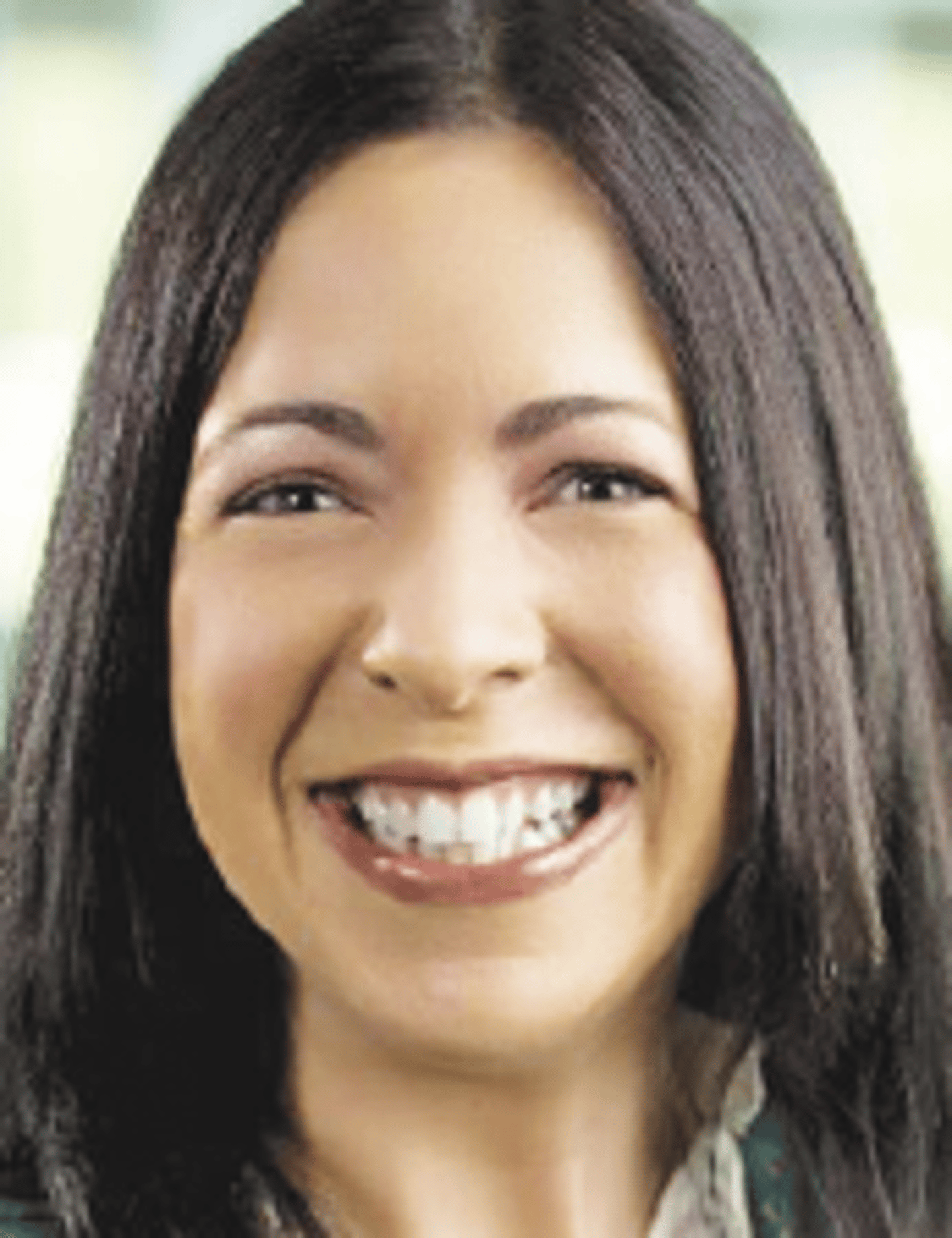 a close up of a woman who is smiling at the camera