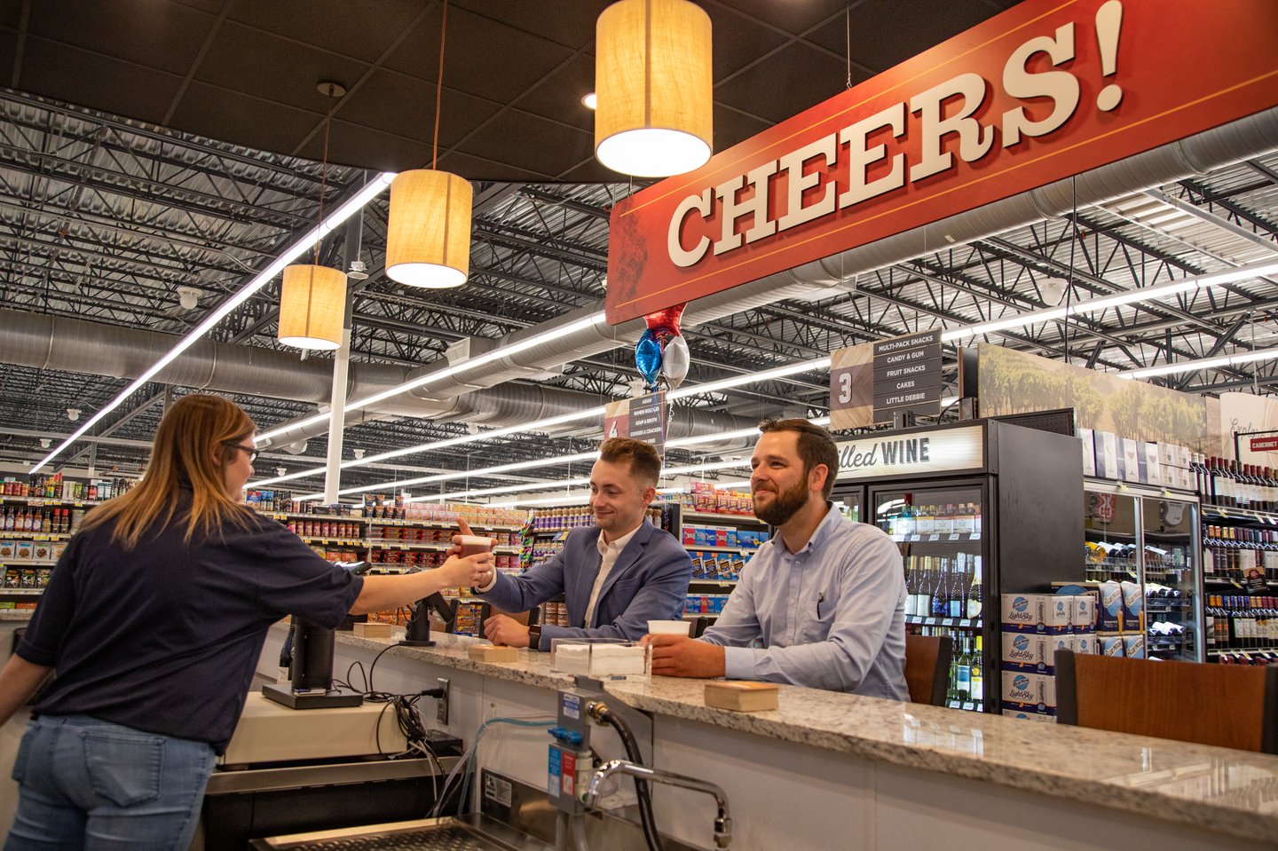 a group of people standing in front of a store