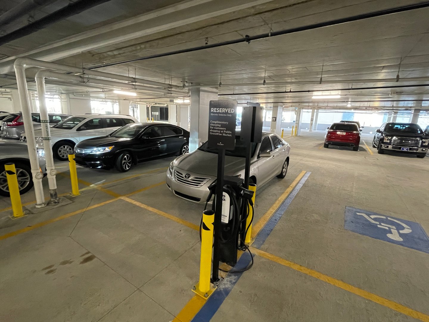 a car parked in a parking lot with luggage at an airport