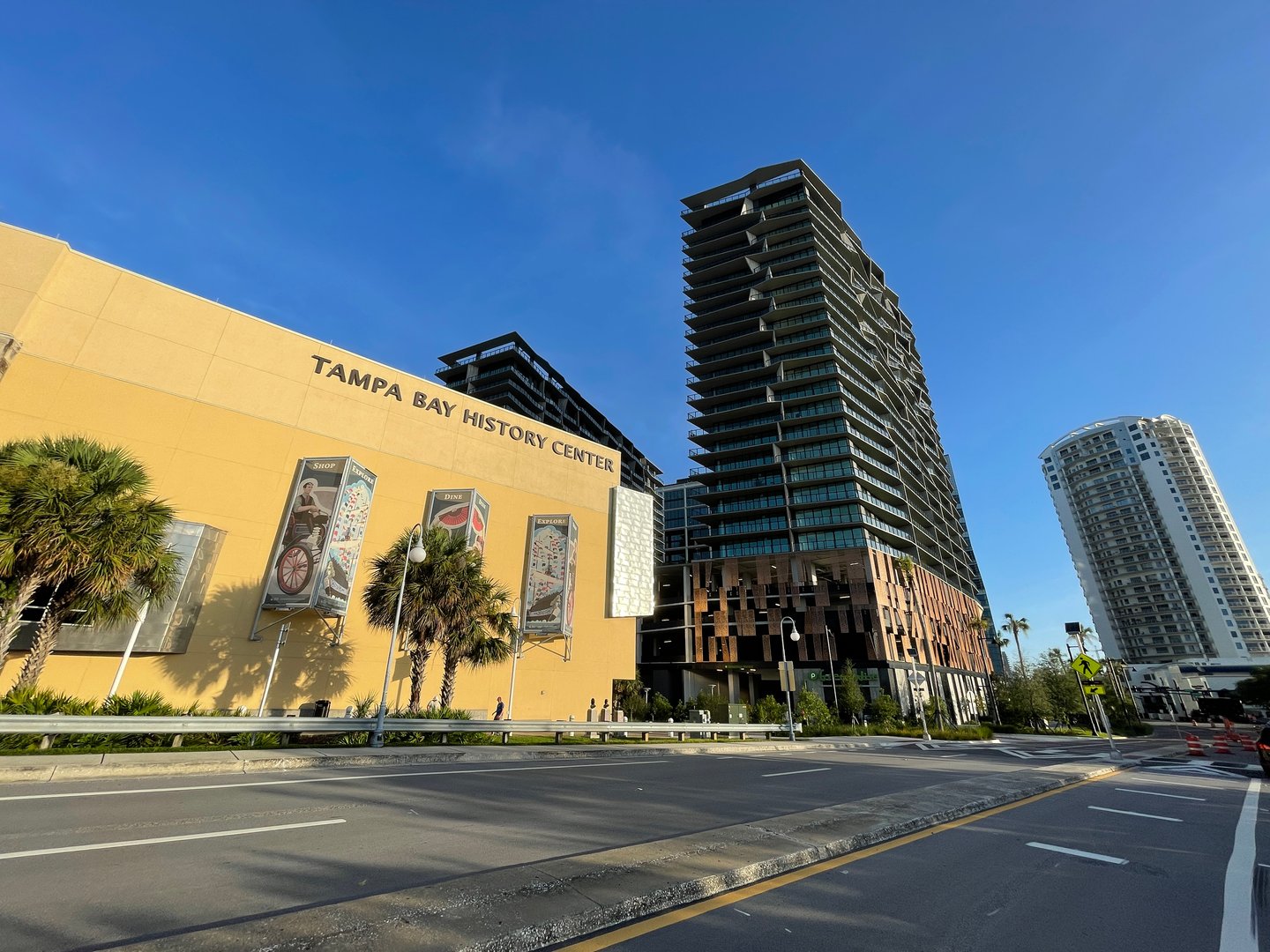 a road with a building in the background