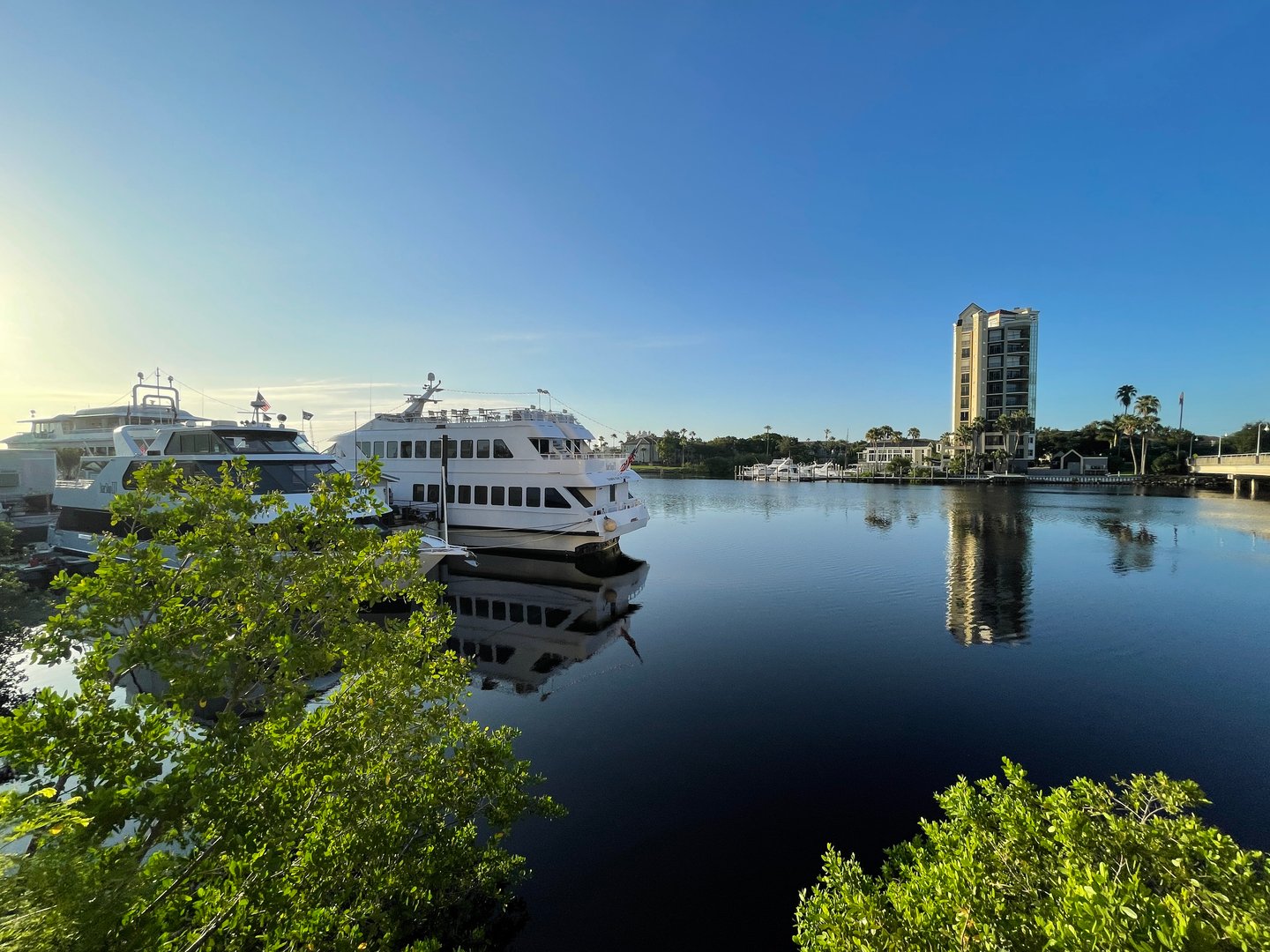 a large body of water with a city in the background