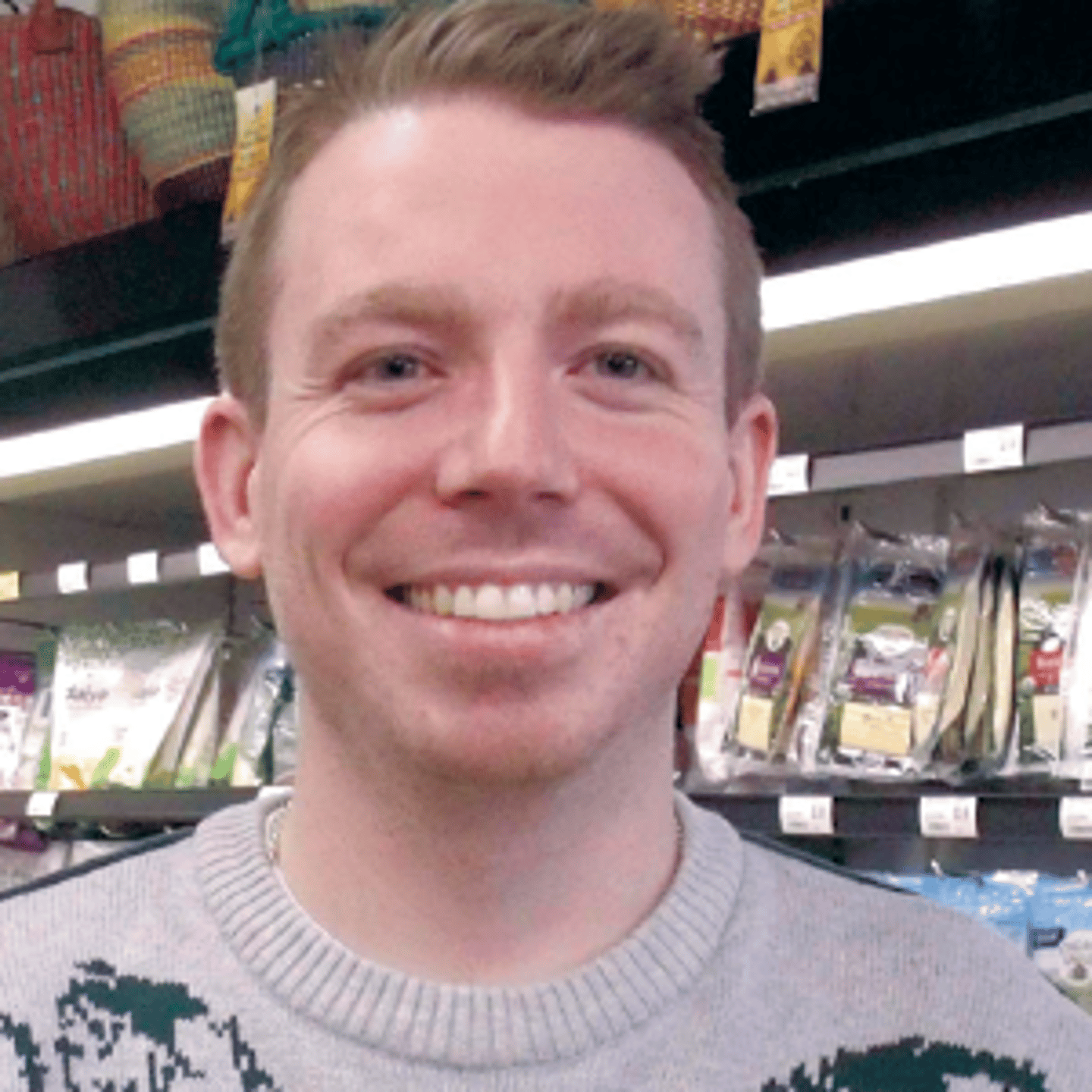 a person posing for the camera in front of a store