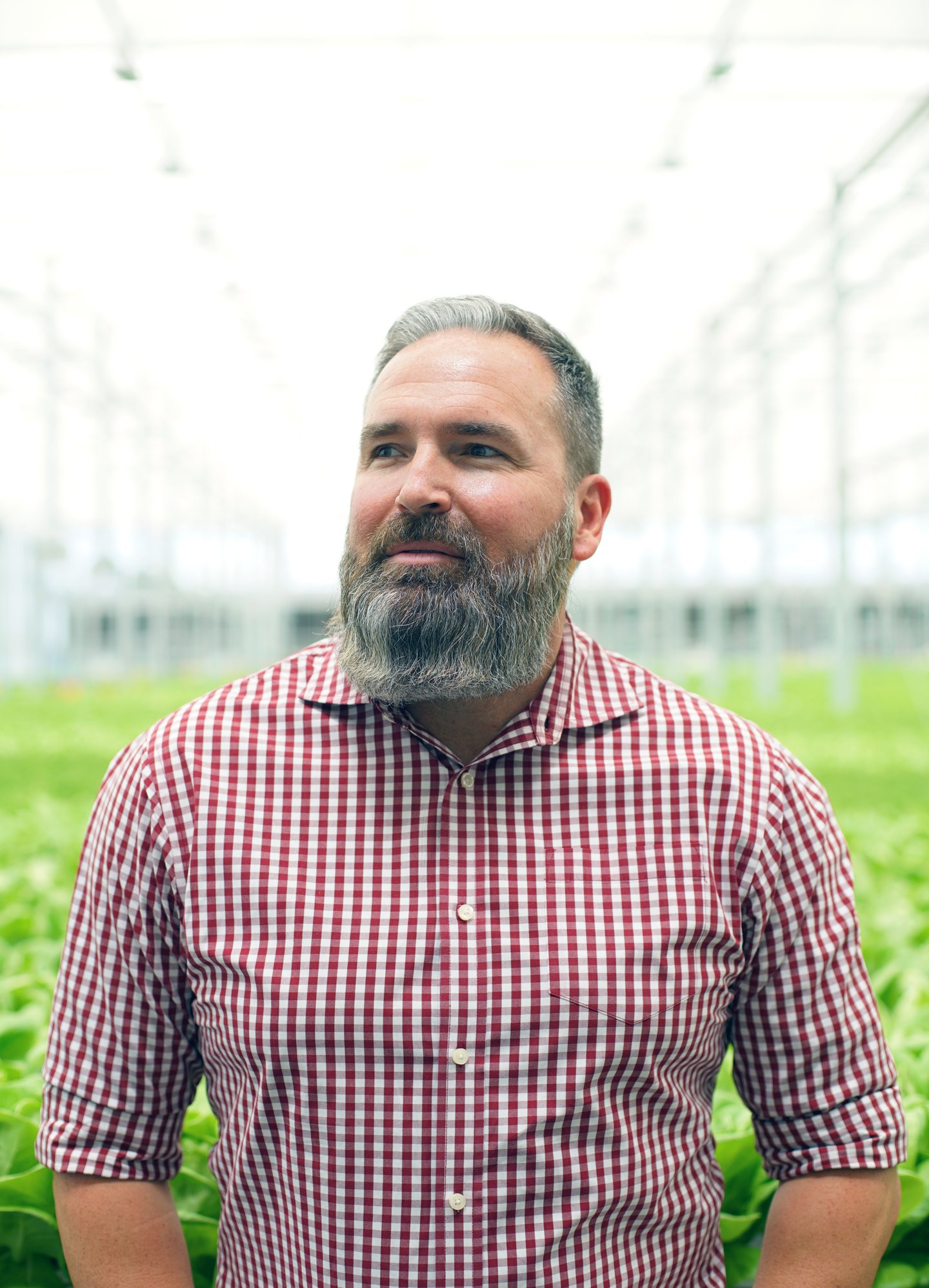 a man that is standing in the grass