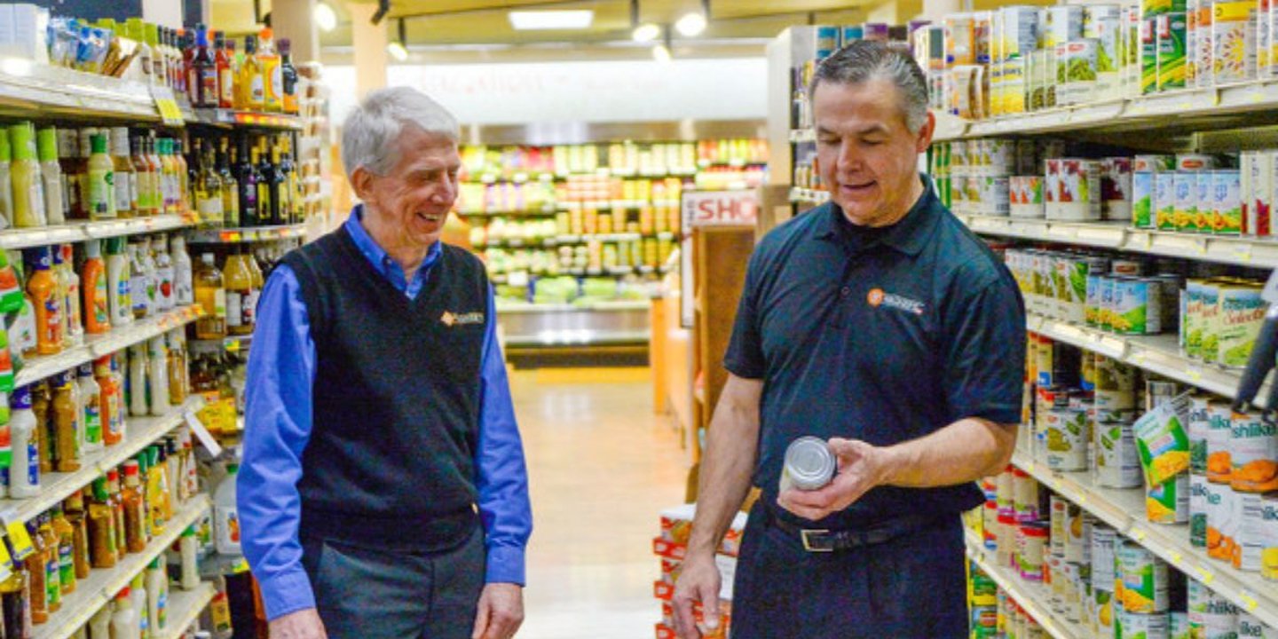 Left to right: Former Wagner's IGA owner Wally Wagner Jr. and new owner Leo Braido