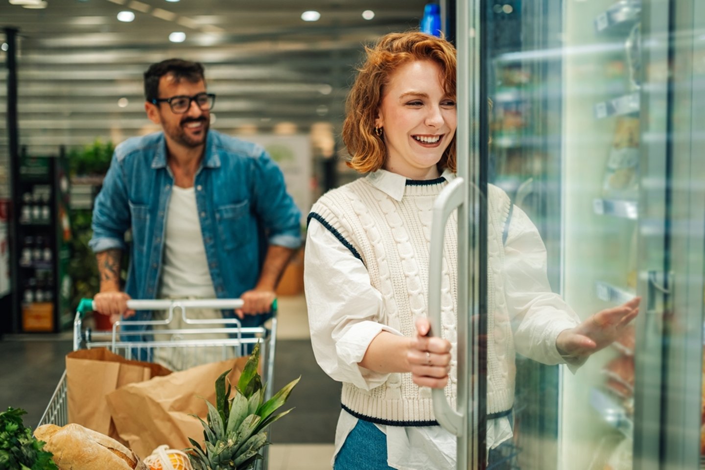 Young Couple Shopping for Frozen Foods Main Image