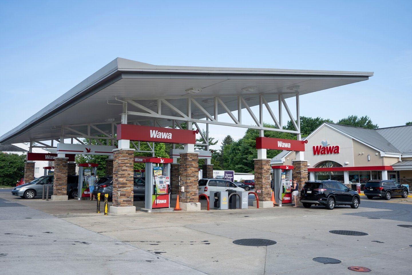 Malvern, PA, USA - June 26, 2022: A Wawa convenience store and gas station in Malvern, Pennsylvania. Wawa, Inc. is an American chain of convenience stores and gas stations along the East Coast.; Shutterstock ID 2224966645