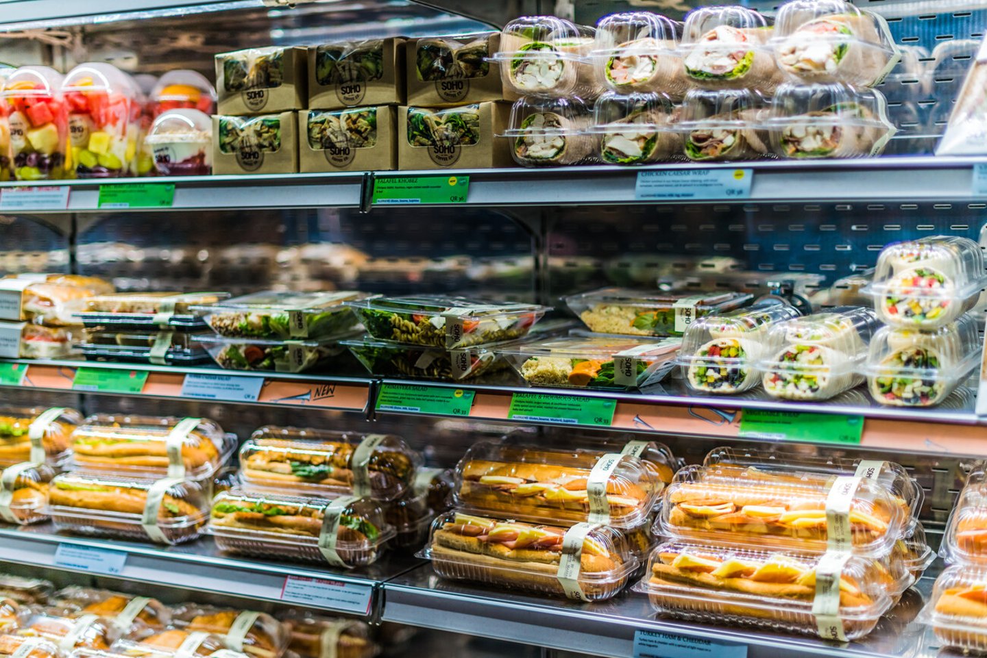 DOHA, QATAR - FEB 28, 2020: Pre-packaged foods displayed in a commercial refrigerator; Shutterstock ID 1673377249