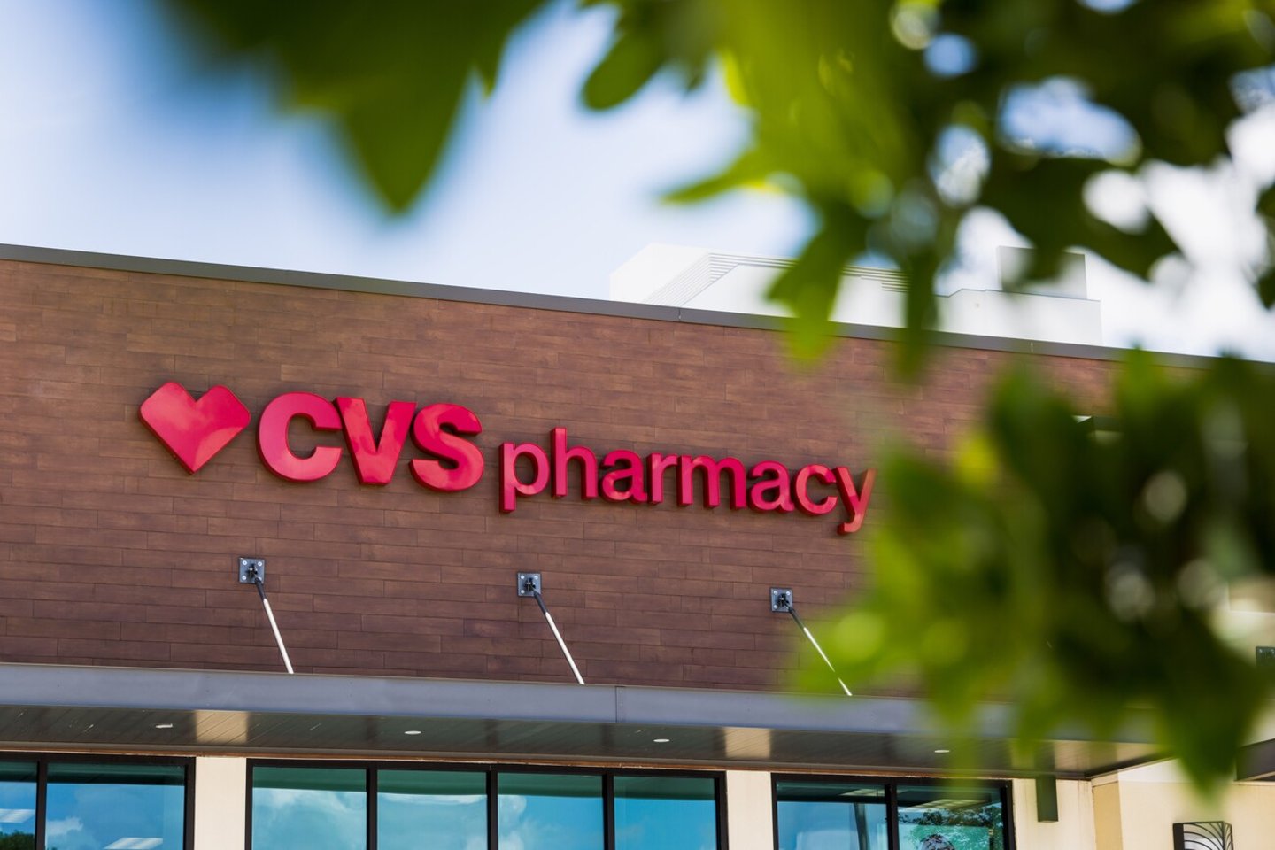 Aventura, Florida - July 2nd 2022: A CVS Pharmacy overlooks an empty parking lot on a hot summer day.; Shutterstock ID 2174334827