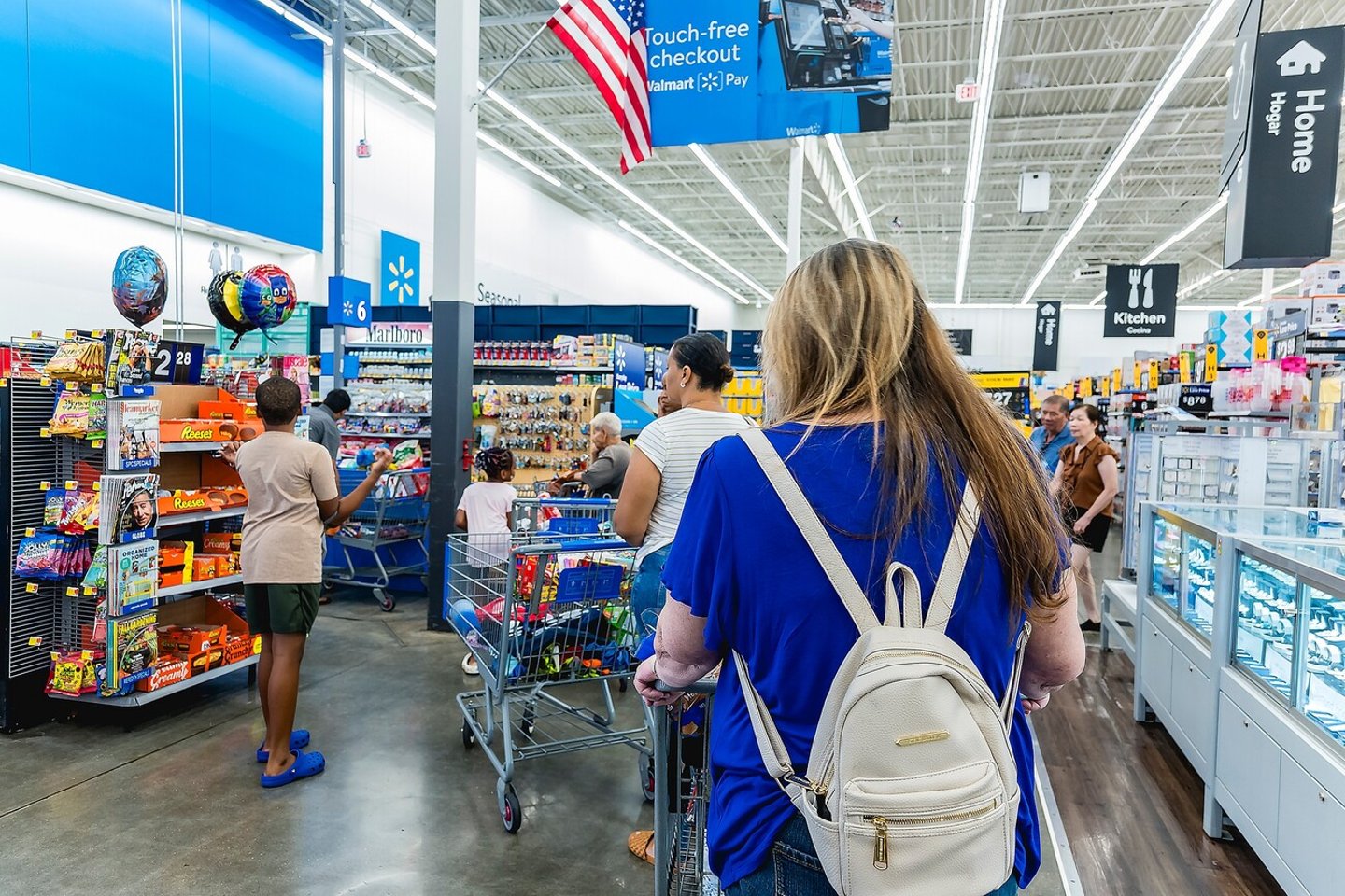 Pembroke Pines, Florida, USA - Aug 1, 2023: People line up at the checkout counter inside a Walmart Supercenter.; Shutterstock ID 2366964129